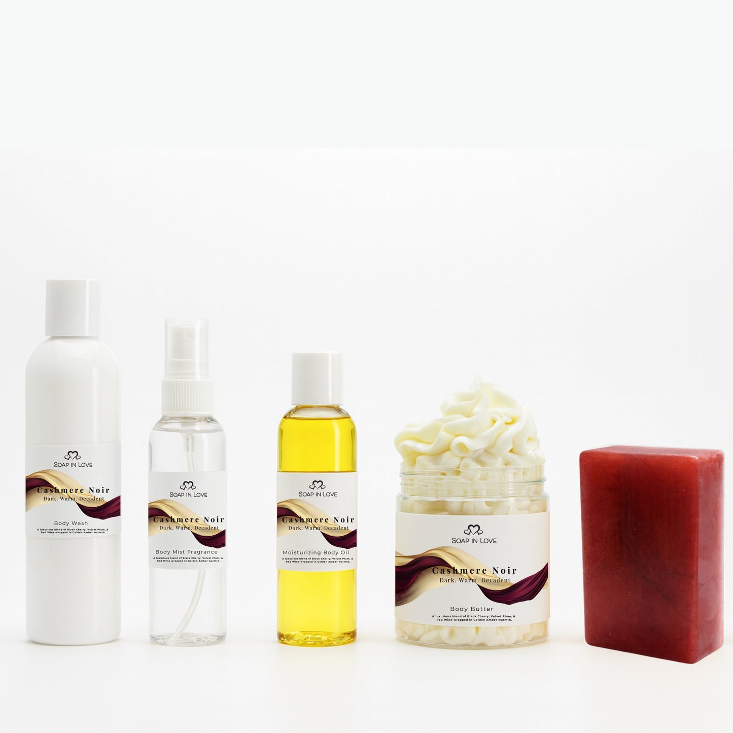 Cashmere Noir Collection of body care products including bottles and a bar on a white background