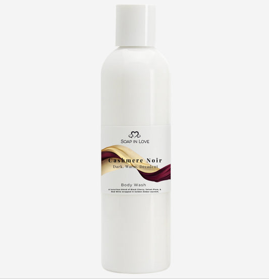 White bottle of Cashmere body wash with a brand logo on a white background