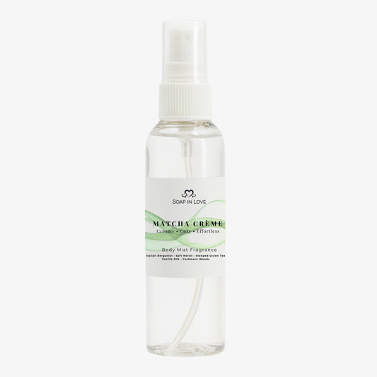 Matcha Crème Body Mist spray with a white cap on a white background