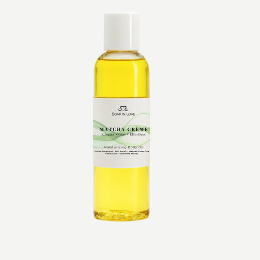 Bottle of Matcha Green body oil on a white background
