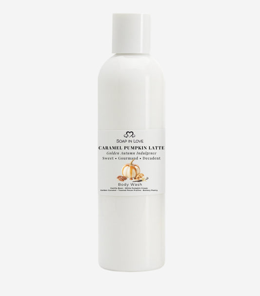 A white bottle of Soap In Love Caramel Pumpkin Latte body soap, featuring a minimalist white label with black text and a small pumpkin illustration, set against a solid light gray background.